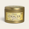 A gold-colored metal tin candle with a textured beige label that reads 'FREESIA CANCER zodiac SOY WAX CANDLE' on a light off-white background.