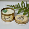 Gaia candle in a tin with a decorative lid on a white background