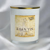 A white soy wax candle in a clear glass jar with a gold metal lid, featuring a vintage-style tan label that reads 'KUAN YIN Goddess' and 'LOTUS VANILLA SOY WAX CANDLE'.