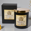 Shakti Sandalwood Saffron candle with packaging on a light background